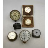 Five various old vehicle instrument clocks and two travel clocks - all a/f (box)