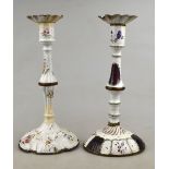 Two Georgian enamel (possibly Bilston) baluster candlesticks with domed feet and floral decoration,