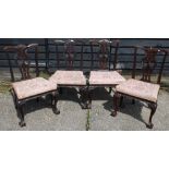 A set of four 19th century Chippendale style mahogany side chairs having well-carved detail,