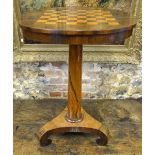 A Victorian rosewood games table, the circular tilt top with chequer-board inlay, raised on a