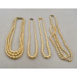 A triple row of simulated pearls on paste set snap,