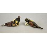 A pair of Bergmann-style cold-painted bronze figures of a gypsy boy and girl with fiddle and