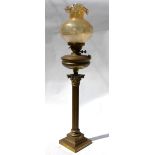 A Victorian cast brass Corinthian column style oil lamp with champagne glass shade,