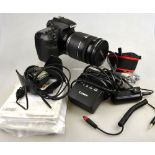A Canon EOS 60D digital SLR camera with 72 mm EF-S 18-200mm zoom lens,
