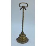 A 19th century weighted brass bell doorstop with rope-cast handle