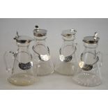 A set of four conical glass whiskey drams with silver collars and covers, Asprey & Co., Ltd.,