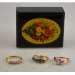 Three yellow and white metal rings, one set with tanzanite, one set with sapphire and diamond,