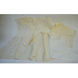 A collection of mostly un-used Victorian cotton and voile infant's gowns with fine lace inserts,