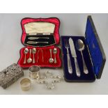 A part set of silver coffee spoons with tongs, a pair of butter knives and a Victorian knife,