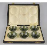 A set of six Chinese spinach jade small bowls, 6 cm diam, in fitted presentation box from H.