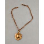 A 9ct rose gold double Albert with swivel having 9ct shield shaped fob attached,