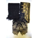 A black net needle-run and embroidered evening stole, 223 cm x 38 cm,