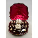 A late Victorian cased presentation set of silver and parcel gilt cream and sugar pair with