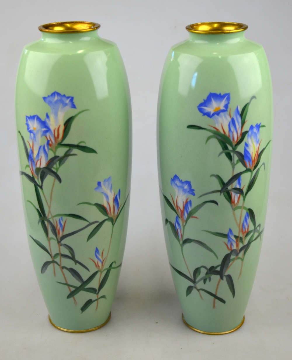 A pair of Japanese slim ovoid vases, pale green ground, decorated with flowers, Meiji, 30.5 cm (2)