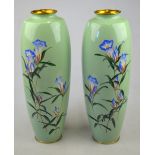 A pair of Japanese slim ovoid vases, pale green ground, decorated with flowers, Meiji, 30.5 cm (2)