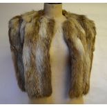 A fox fur evening shoulder cape and a beaver lamb fur coat (2) Condition Report Fox fur worn.