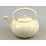 Belleek first period black mark 1863-90 - A cream tea kettle moulded with grasses and having a spout