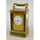 A late 19th century lacquered brass repeating carriage clock,