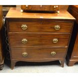 A 19th century mahogany chest of three long graduated drawers raised on splay bracket feet united