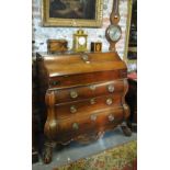 An 18th century Dutch provincial oak bombe shaped bureau,