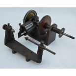 A vintage electrical coil-winder with crank handle,