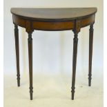 A 19th century Sheraton style polychrome decorated demi-lune table raised on four reeded turned