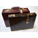 An expanding Franzen leather briefcase to/w another leather briefcase (2)