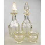 A pair of heavy facetted decanters with star cut bases to/w two hobnail cut posy vases (4) Condition