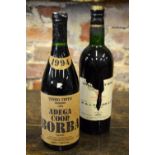 A bottle of Graham's Vintage Port Wine (label torn), to/w a 1994 Adega Coop.