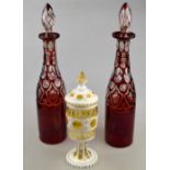 A pair of 19th century Bohemian ruby flash glass decanters, 38.5 cm h. to/w a continental white