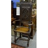 A pair of 19th century Gothic Revival jointed open armchairs having a carved and moulded frame to a