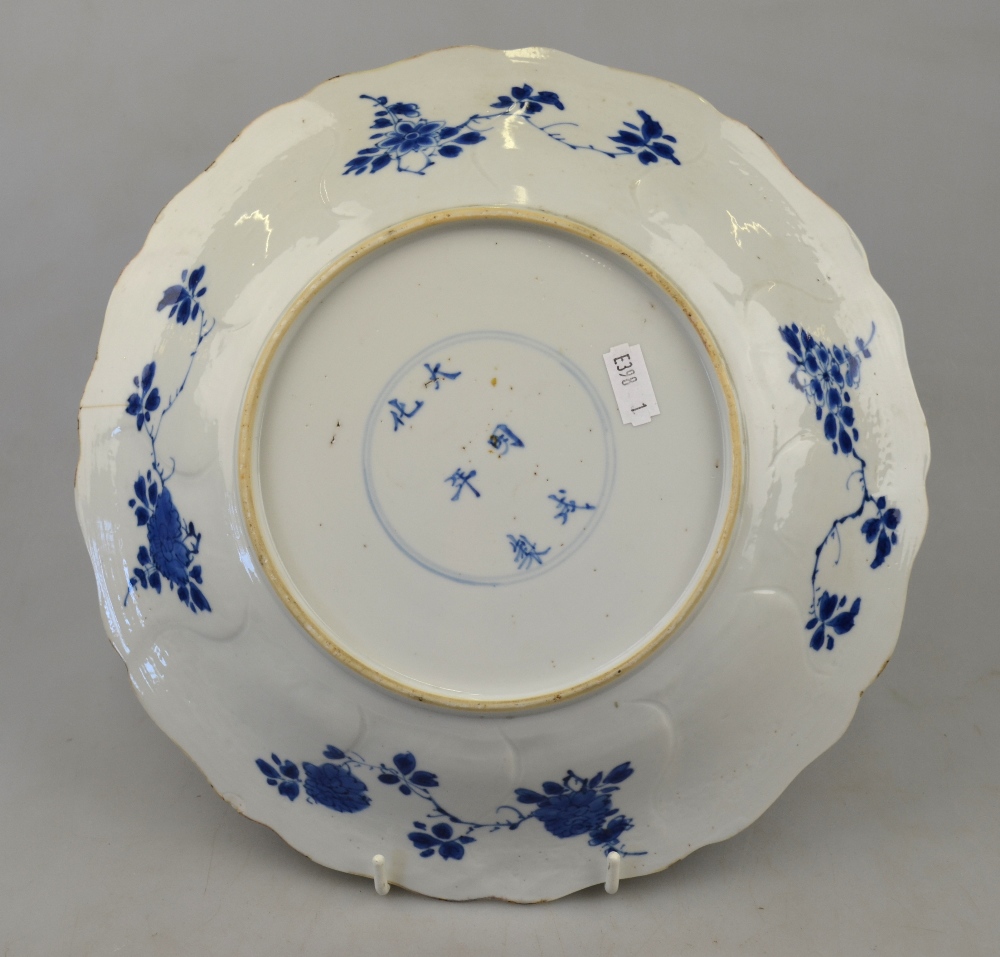 A Chinese blue and white moulded dish decorated with a bird perched on rockwork amidst flowers, - Image 2 of 3