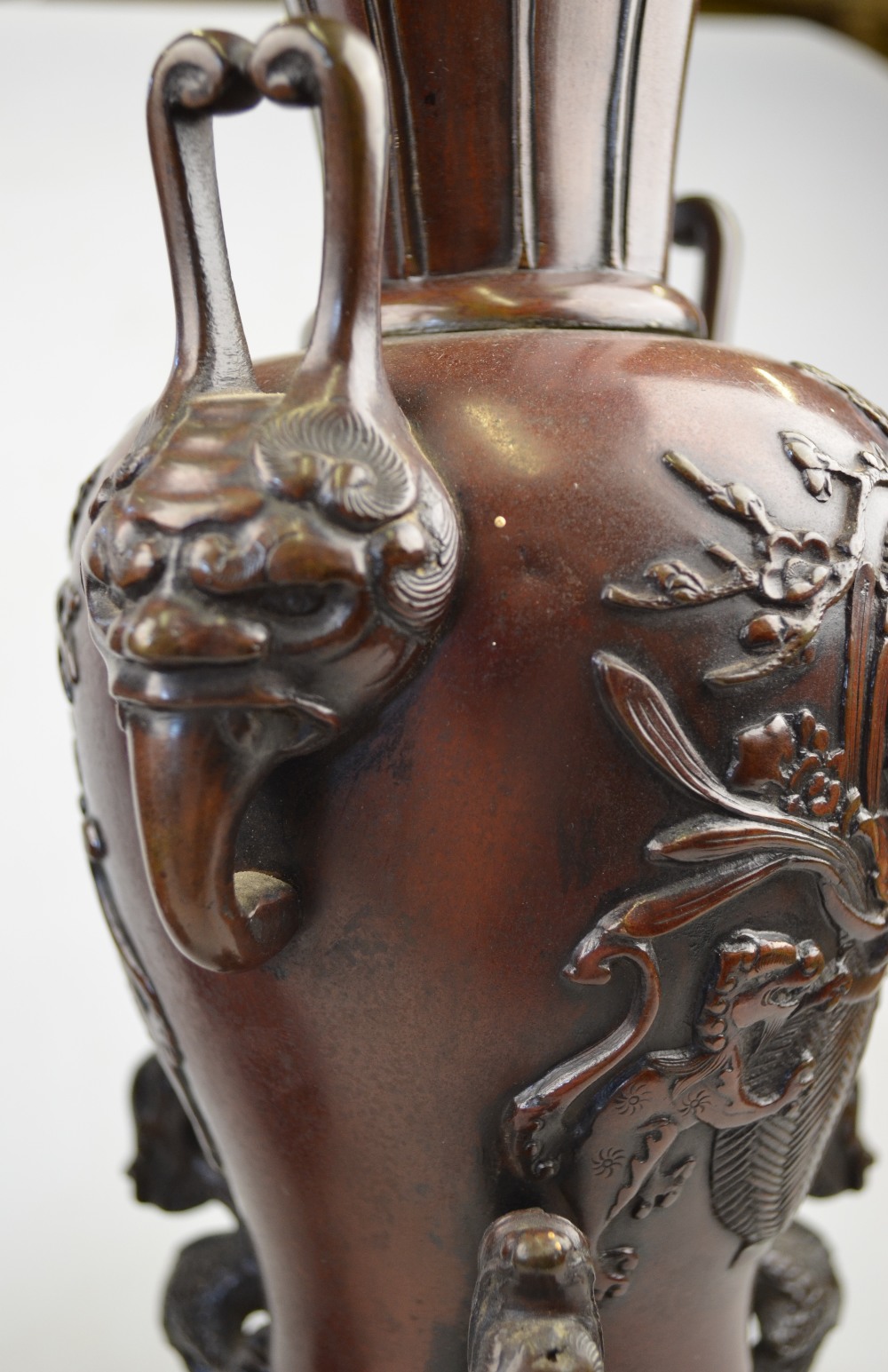 A pair of Chinese bronze vases each cast with a vase of flowers, twin mask handles, supported by - Image 3 of 3