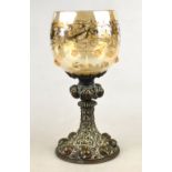 A German glass goblet vase with enamel decoration and strawberry prunts,