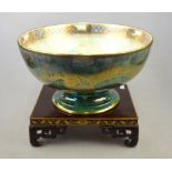 A large Wedgwood lustre footed bowl deigned by Daisy Makeig-Jones, the exterior decorated with