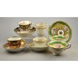 A collection of 19th century cabinet cups and saucers comprising two English Imari decorated