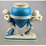 A 19th century porcelain vase in the form of a classical vessel supported by two putti, raised on