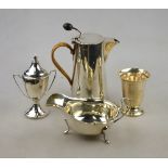 A silver hot milk jug of tapering form with bean finial and wicker-bound handle, Hukin & Heath,