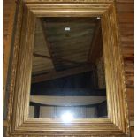 An antique giltwood and composite picture frame - now fitted with a mirrored plate,