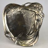 An Art Nouveau electroplated dish of heart design, decorated with nymph and harp, unmarked,