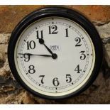 A Smith 8-day ship's bulkhead clock with enamel dial and metal case,