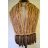 A shadowed blond mink stole embellished to ends to ten mink tails,