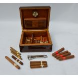 A coromandel cigar humidor, complete with a selection of cigars and cigar-cutter with antler