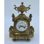 A brass cased 8-day mantel clock in the rococo style, the movement stamped B.R.