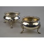 A pair of heavy quality silver circular open salts with gadrooned rims, on hoof feet,