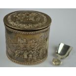 A late Victorian oval silver tea caddy with hinged cover, richly embossed and chased in the