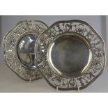 A pair of 19th century German .800 grade dishes, the pierced rims decorated with gryphons and