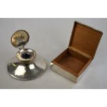 An Edwardian silver capstan inkwell, A & J Zimmerman, Birmingham 1908, to/w a cigarette box,