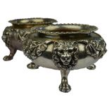 A pair of oversize Victorian heavy cast silver open circular salts with shell and gadroon rims,