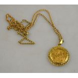 A 1908 sovereign on ornate 9ct mount on gilt metal chain